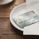 Illustration for article titled Restaurant adds 4% to bill for using a credit card: Smart business or taxing the cashless?